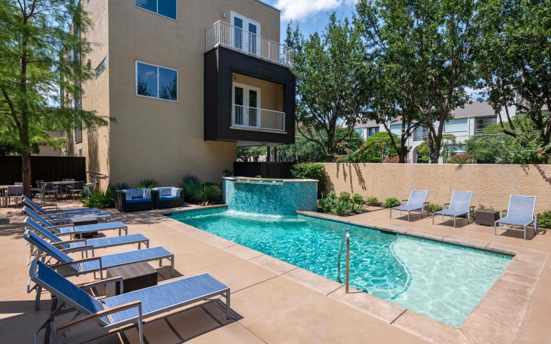 a pool with chairs around it