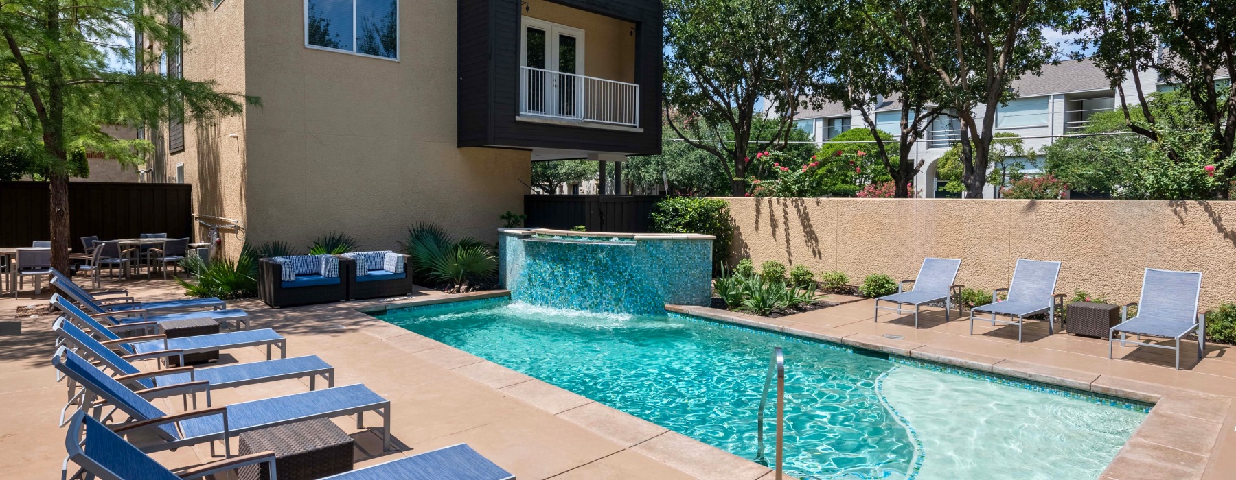 a pool with chairs around it