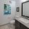 a bathroom with a large mirror